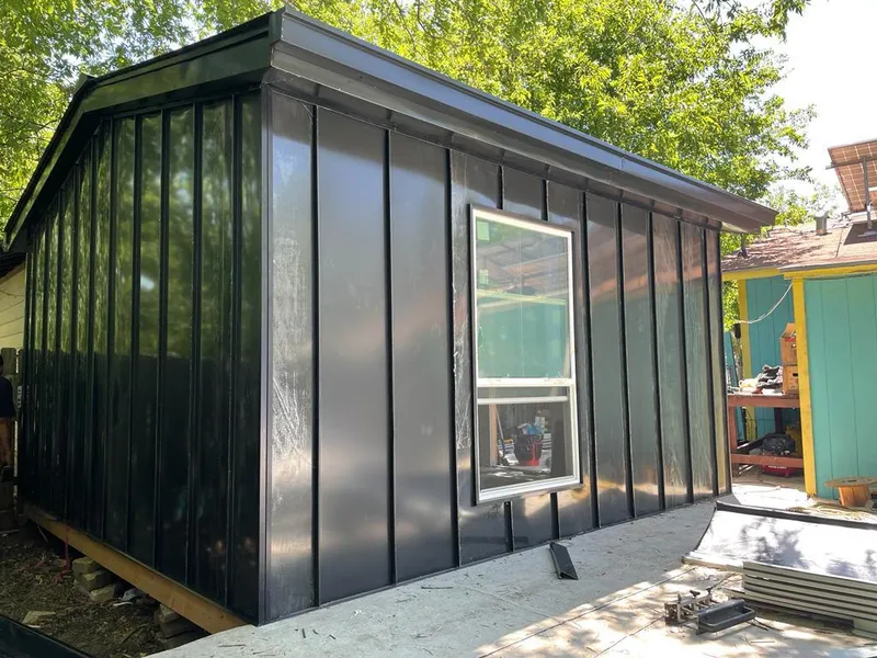 Black standing seam metal wall panels for Roof Inspection in Murraysville